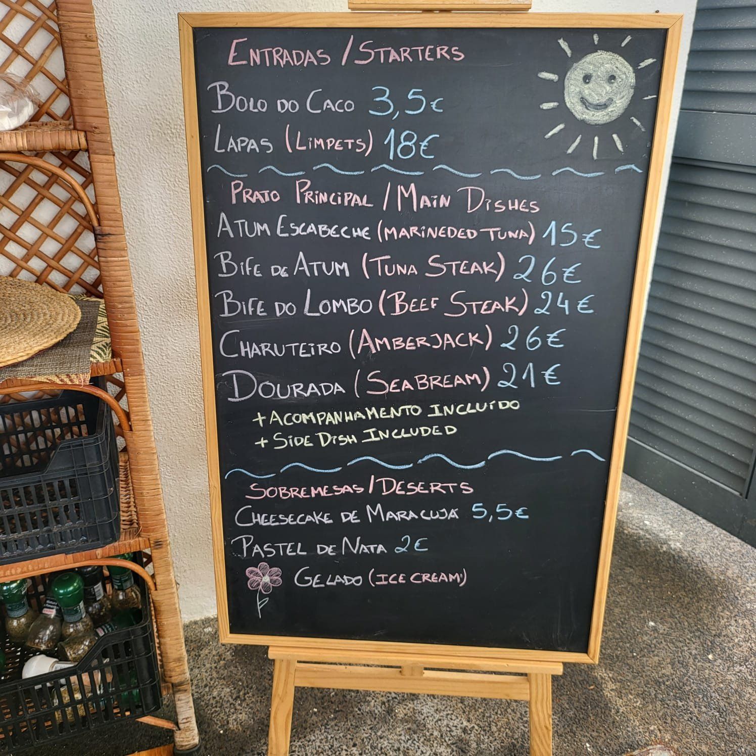 Chalkboard menu at Bar Praia da Laje, Seixal - lapas EUR 18, tuna steak EUR 26, amberjack EUR 26, sea bream EUR 21, passionfruit cheesecake EUR 5.50