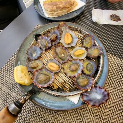 Grilled limpets (lapas) with garlic butter and lemon at Bar Praia da Laje, Seixal, Madeira
