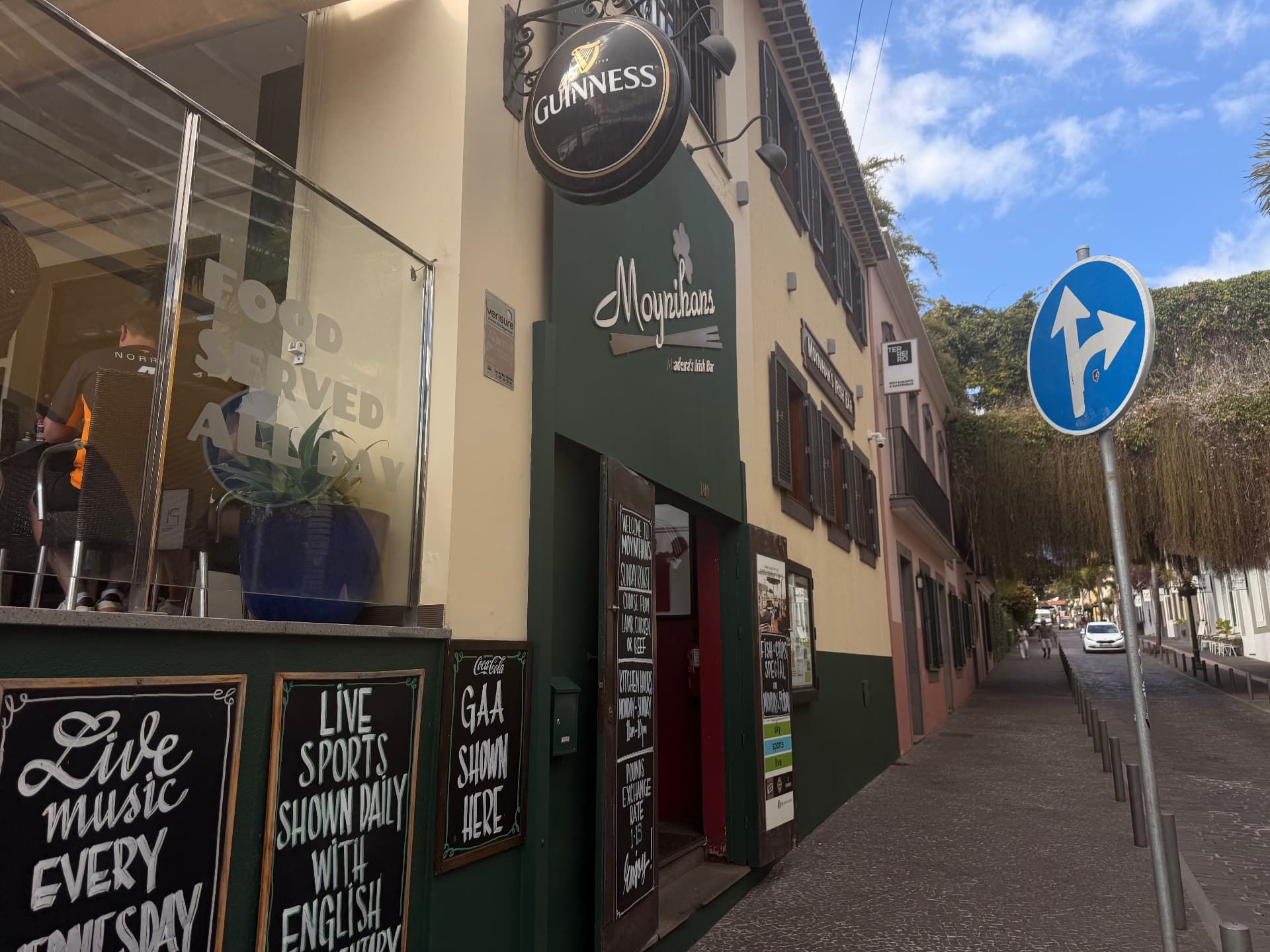 Exterior of Moynihan\u0027s Irish Bar in Funchal with Guinness sign and street entrance