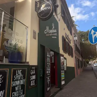 Exterior of Moynihan\u0027s Irish Bar in Funchal with Guinness sign and street entrance