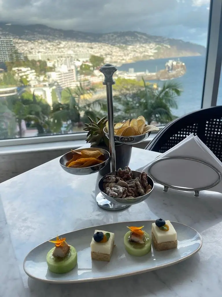 Canapés, crisps and candied nuts with a panoramic view over Funchal Bay from the Champagne Bar at Belmond Reid's Palace, Madeira