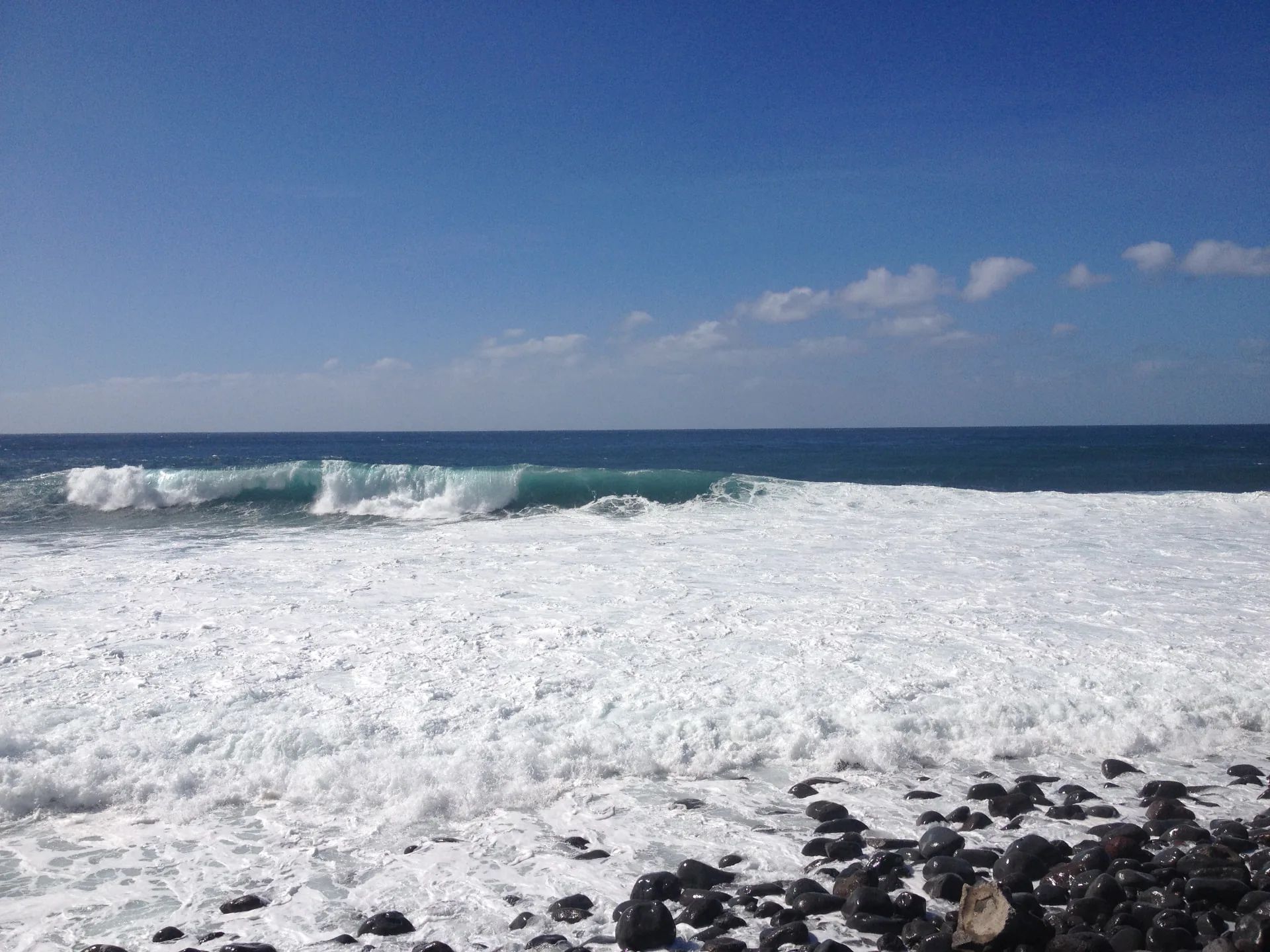 Large Atlantic wave breaking beside the pebble beach at Paul do Mar, Madeira