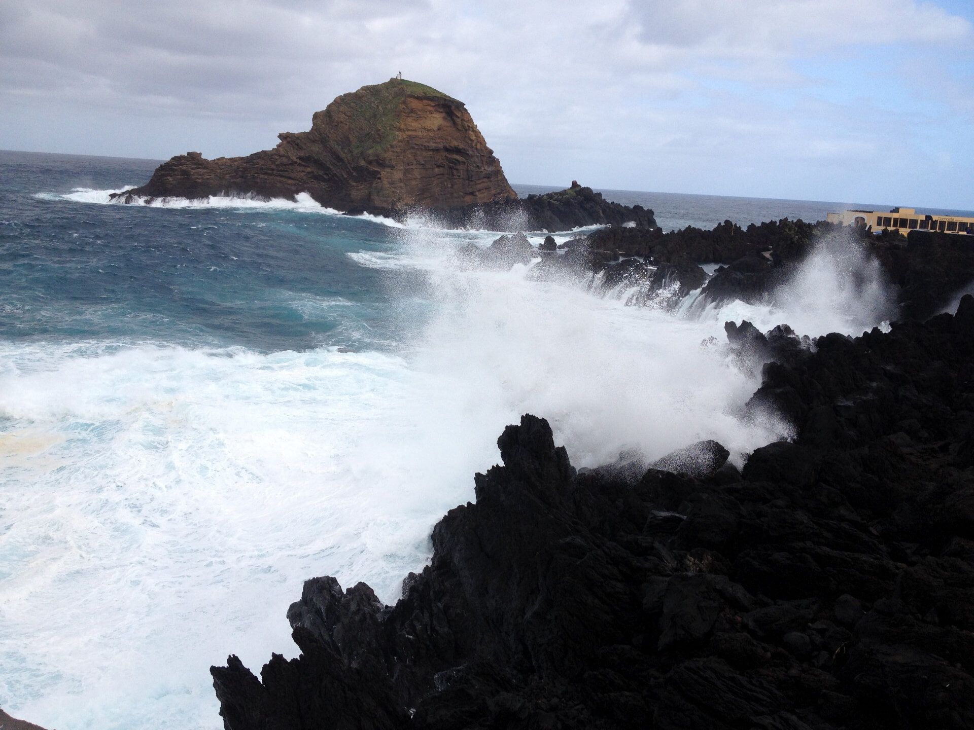Waves breaking in front of Ilhéu Mole beside the Porto Moniz pools