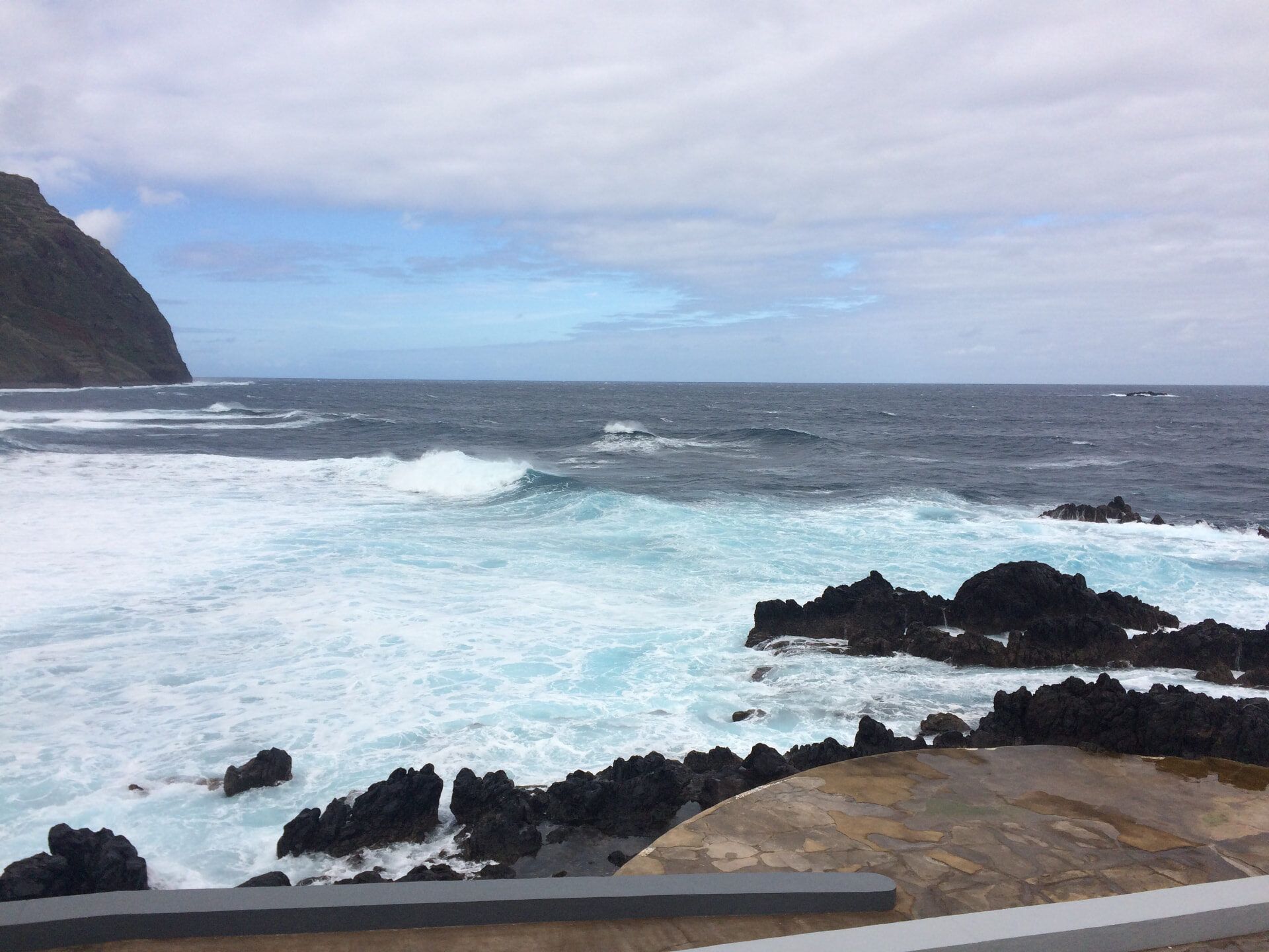 Turquoise surf around the volcanic rocks of the Porto Moniz pools
