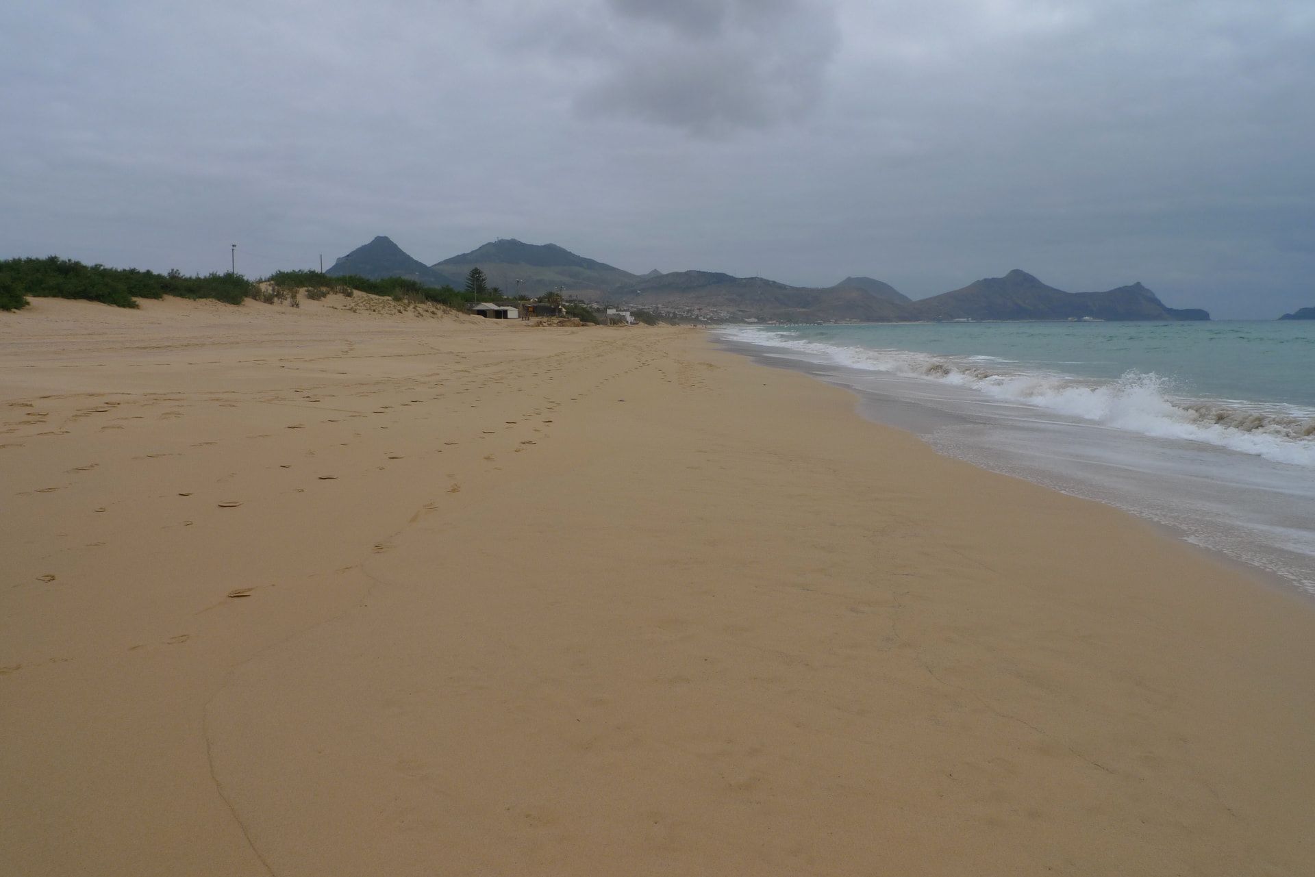 The long empty stretch of Porto Santo beach looking towards Pico do Castelo.