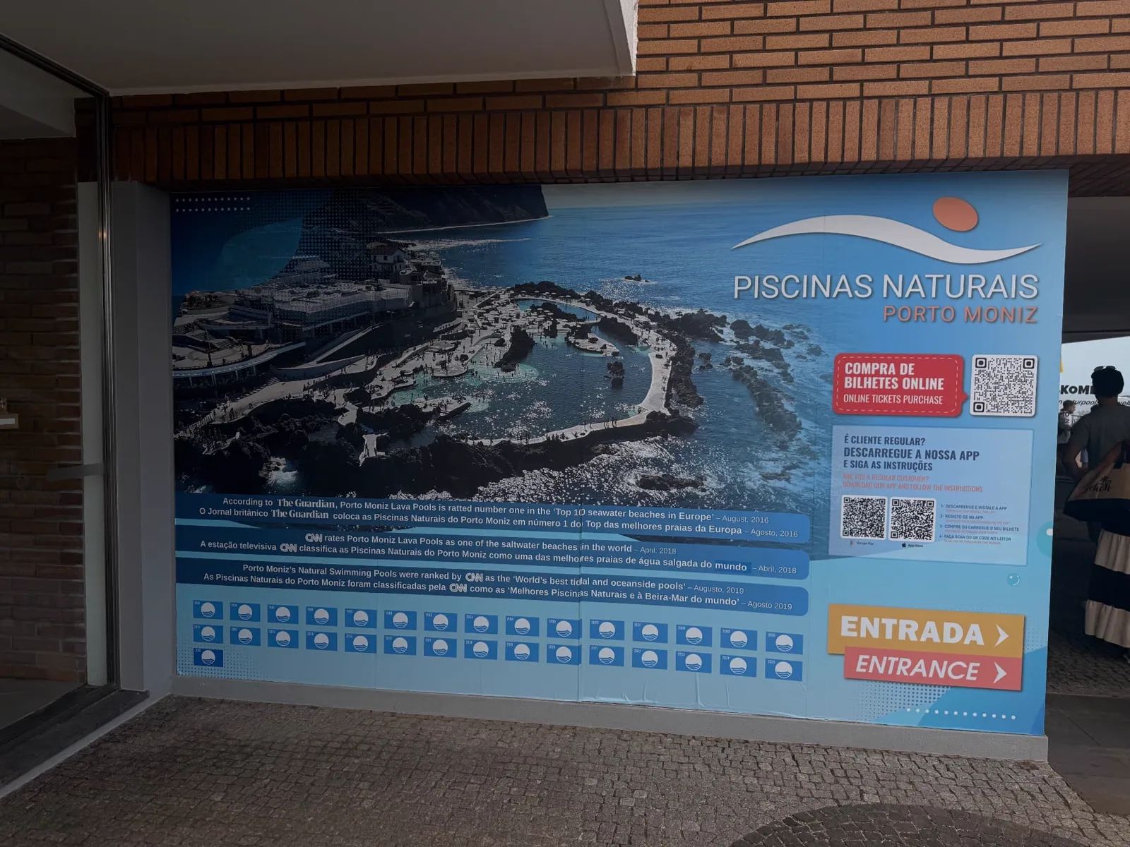 Entrance board of the Piscinas Naturais do Porto Moniz with online ticket QR code