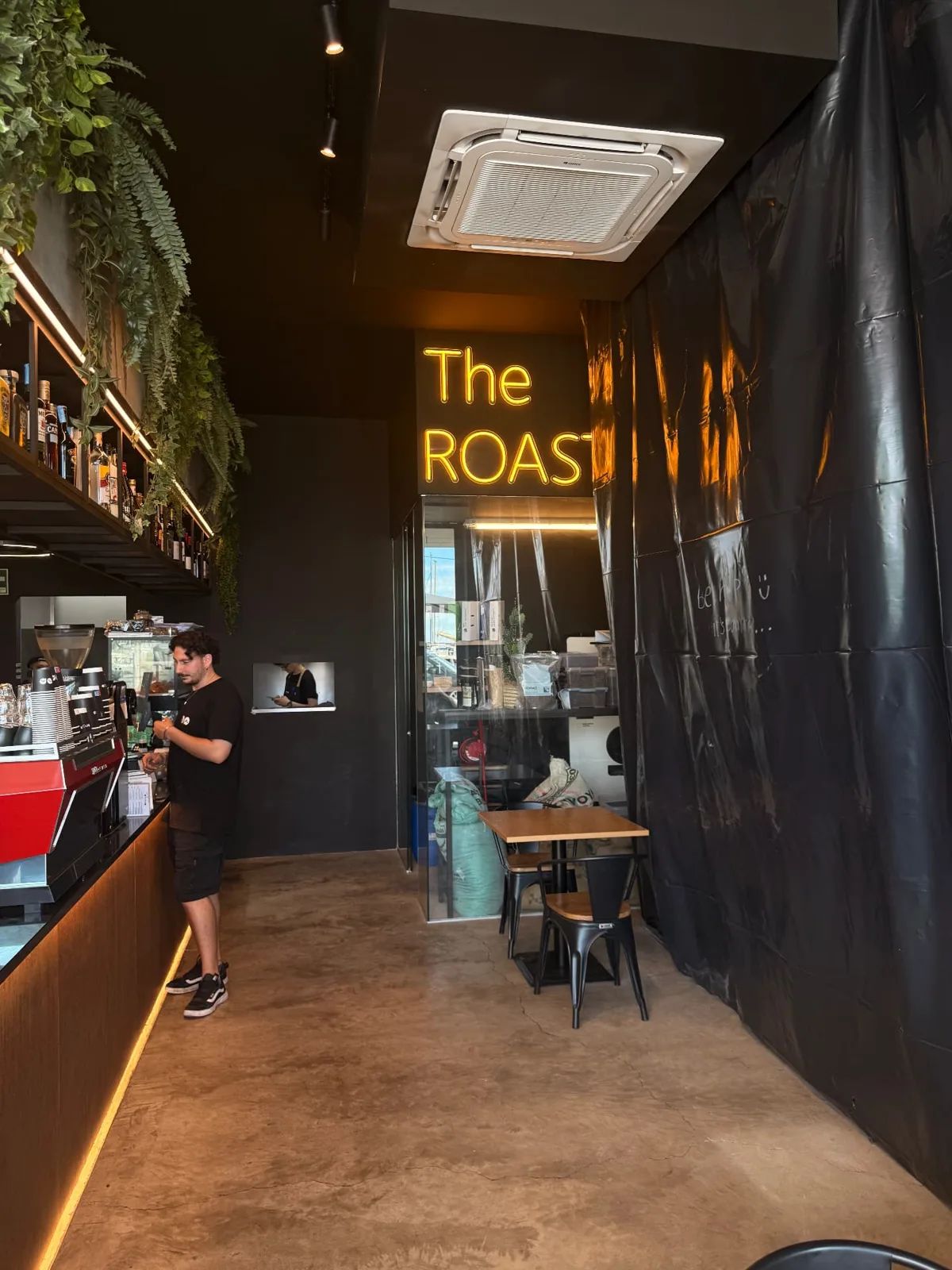 The glass-walled coffee roastery corner inside Beanup, Funchal