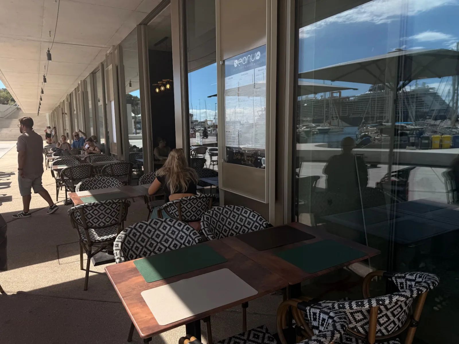 Beanup terrace tables under the arcade at Funchal Marina