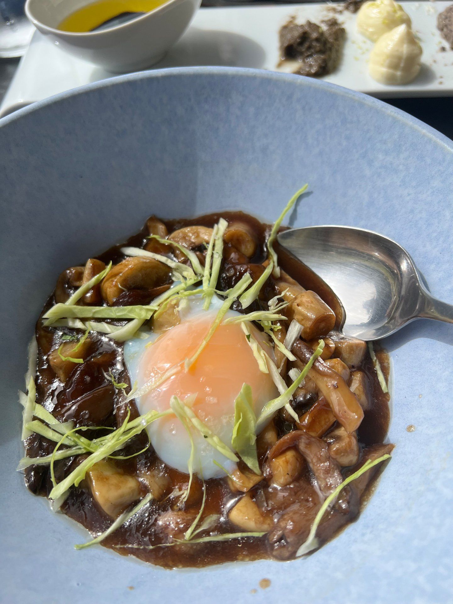 Mushroom ragu with a slow-cooked egg and shredded greens at Fuga Bistro Bar, Caniço, Madeira