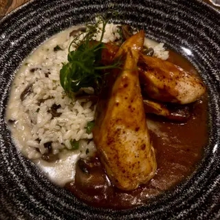 Grilled squid with seafood risotto at Il Basilico Tuscan restaurant on the Lido promenade in Funchal, Madeira