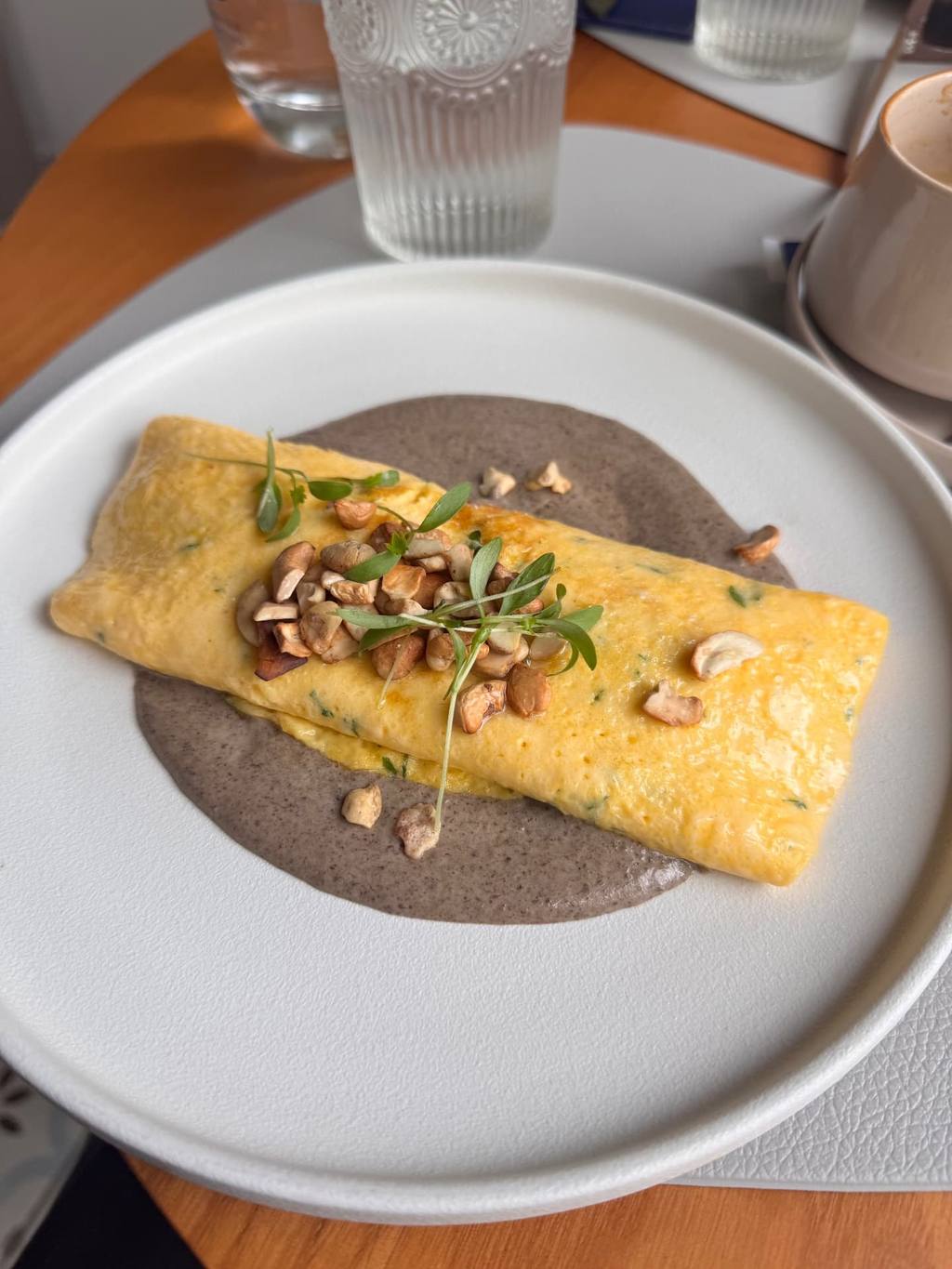 Mushroom and cashew omelette over mushroom cream at Nomade brunch restaurant in Funchal, Madeira
