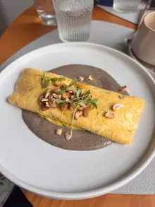 Mushroom and cashew omelette over mushroom cream at Nomade brunch restaurant in Funchal, Madeira