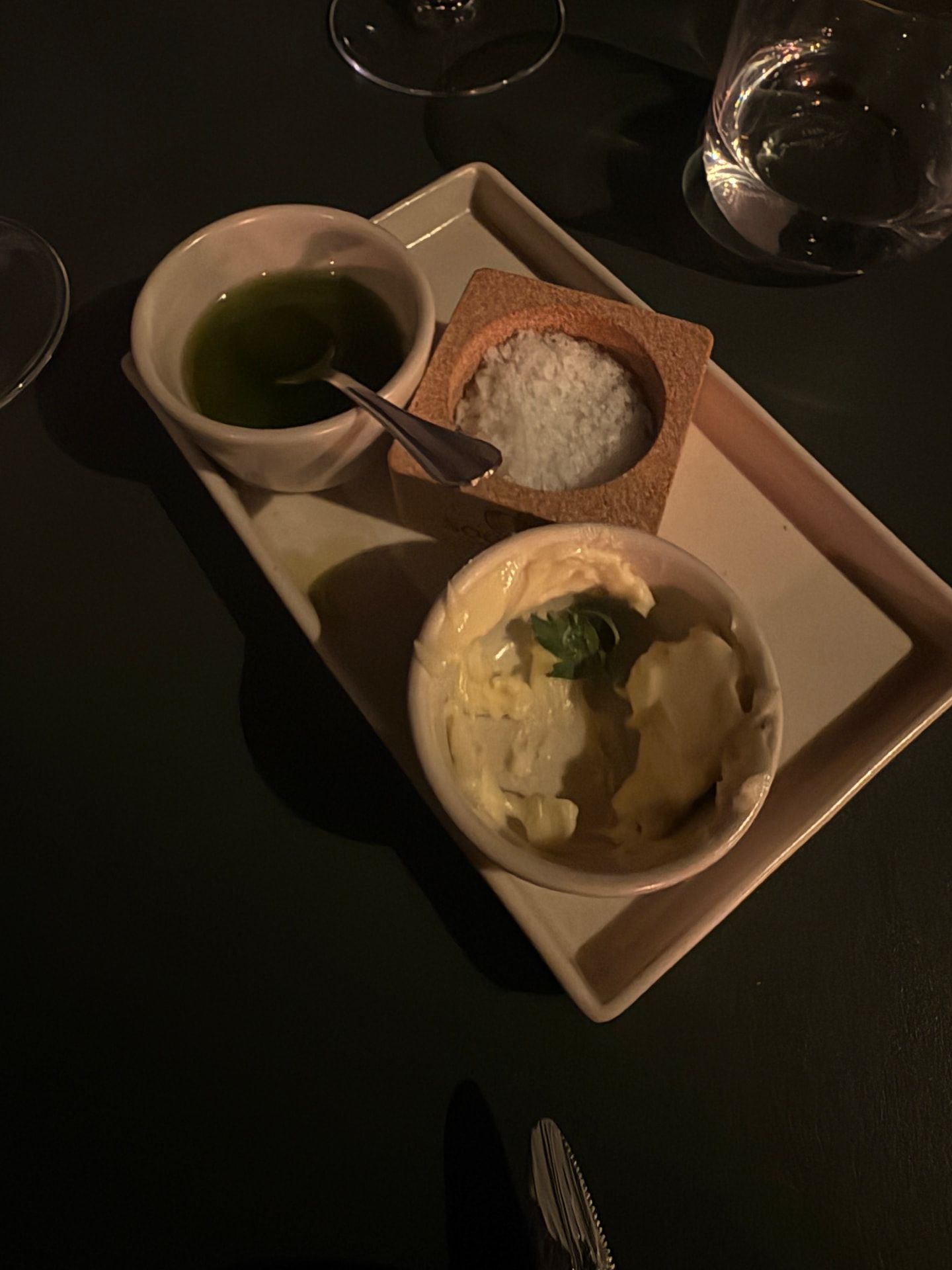 Tray of sauces, flavoured salt and butter served with the tasting menu at Razão, Calheta