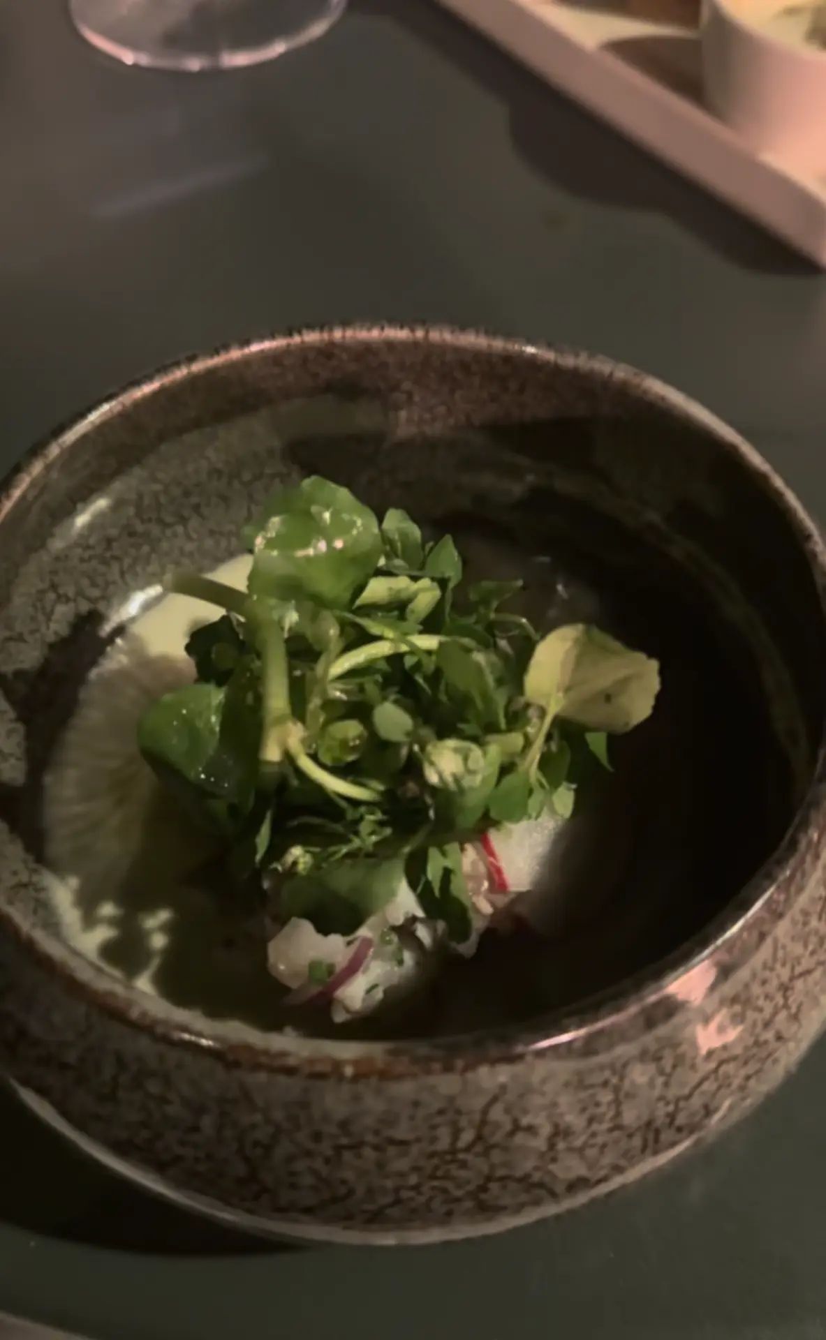 Cured fish starter with fresh herbs from the tasting menu at Razão, Calheta