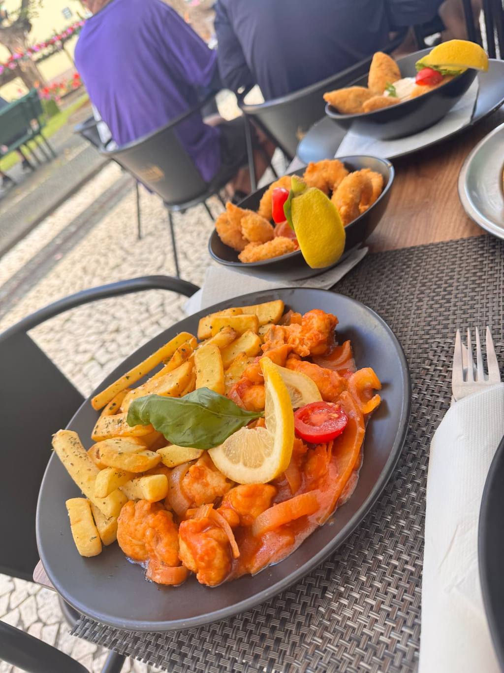 Garlic prawns in tomato sauce with crispy chips, lemon and basil at Rota dos Sabores, Santa Cruz, Madeira