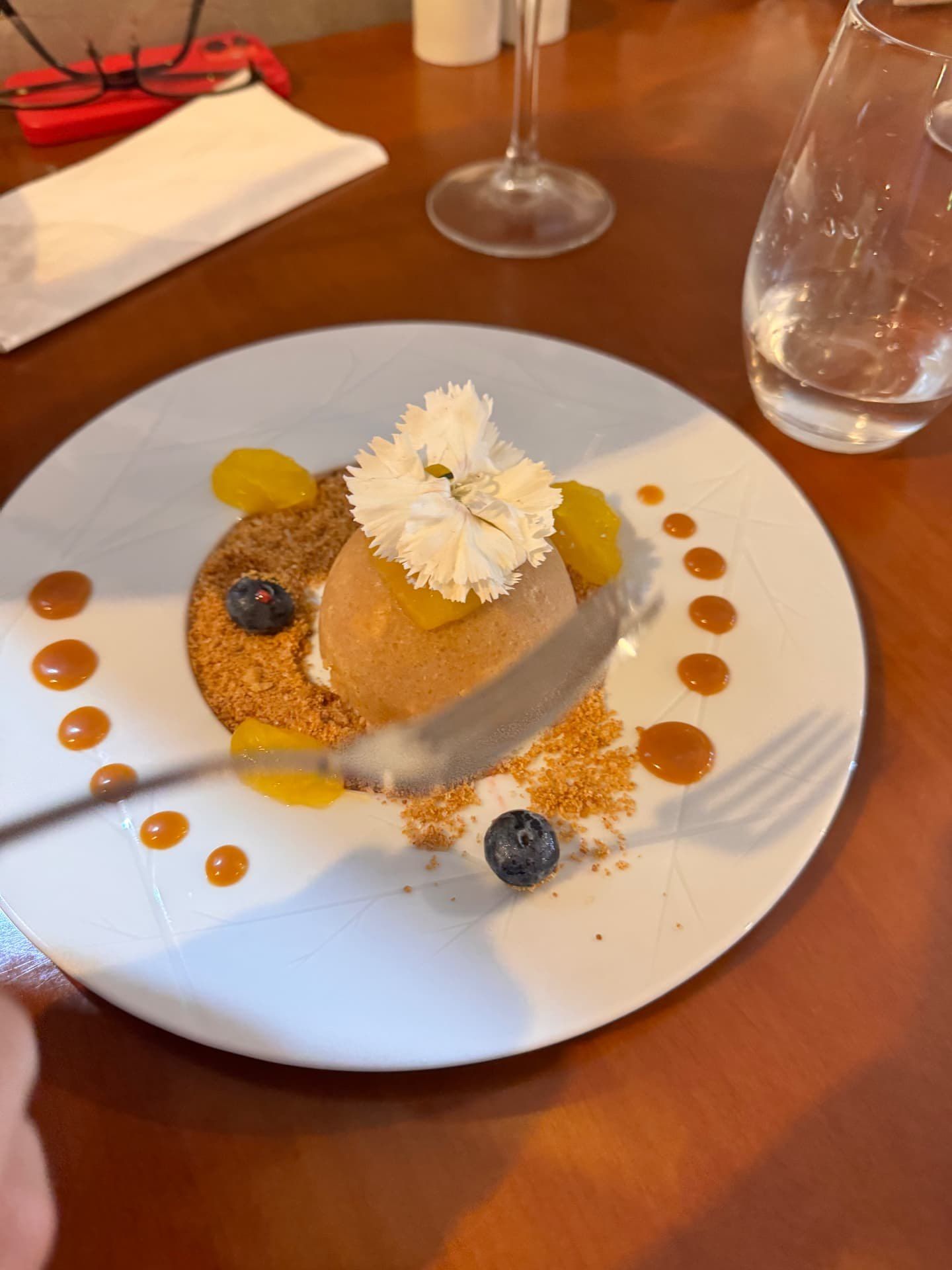 Caramel parfait dessert with crumble and edible flower at 5 Sentidos restaurant, Funchal, Madeira
