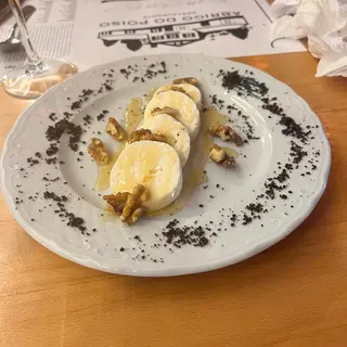 Fresh cheese with honey and walnuts, the classic Madeiran starter at Casa de Abrigo do Poiso mountain restaurant on the road to Pico do Arieiro, Madeira