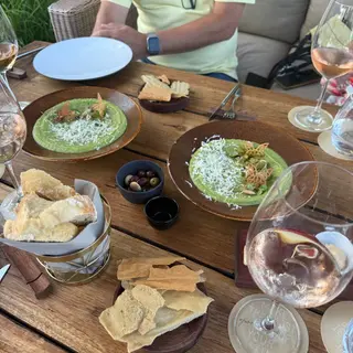 Lunch on the garden terrace at Avista restaurant, Funchal, Madeira, with green pea velouté starters, local bread and Portuguese rosé