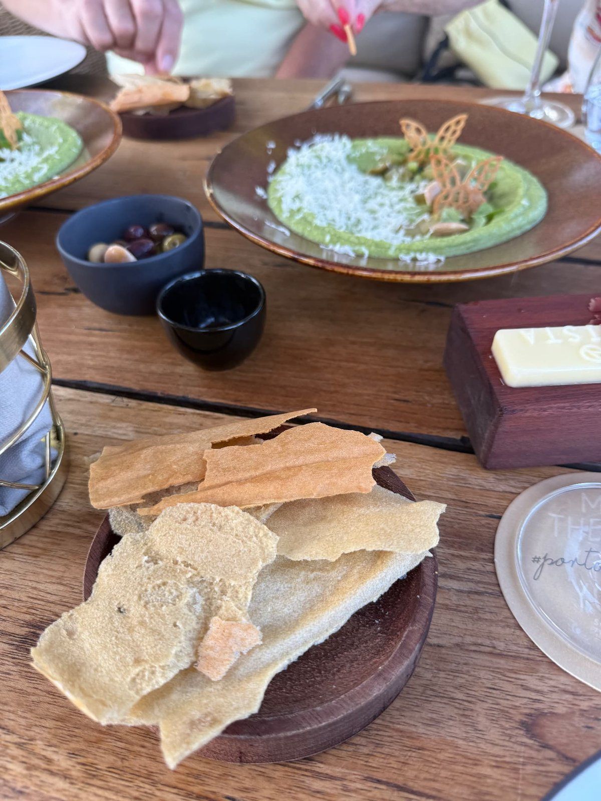Green pea velouté starter with crispbread, olives and Vila Santa butter at Avista restaurant, Funchal, Madeira