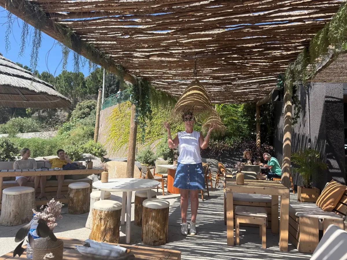 Thatched pergola terrace at Calhau Beach Club on the Calheta seafront, Madeira