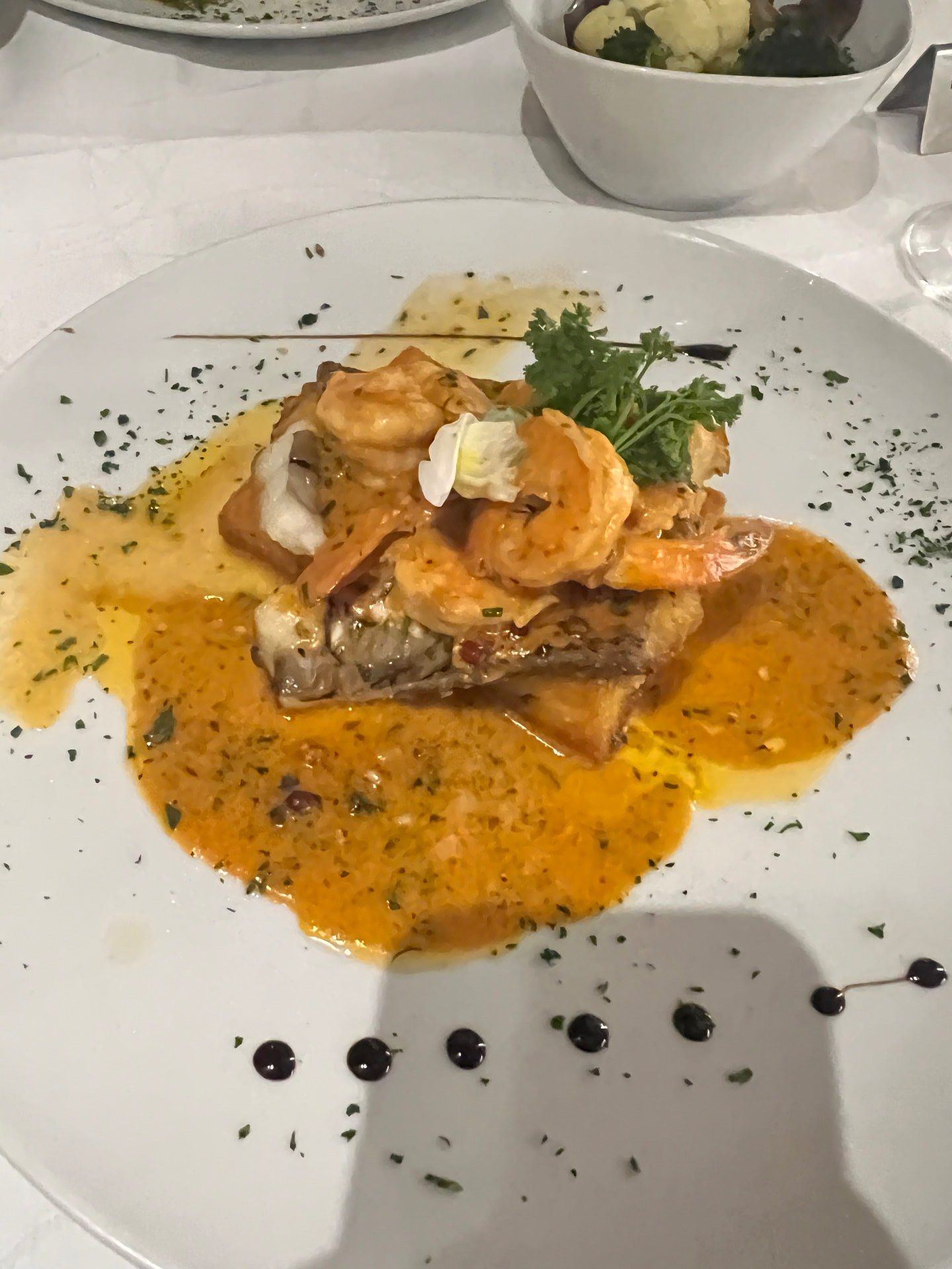 Prawn-topped meat dish in rich jus with vegetables at Franco's Corner restaurant, Rua da Casa Branca, Sao Martinho, Funchal, Madeira