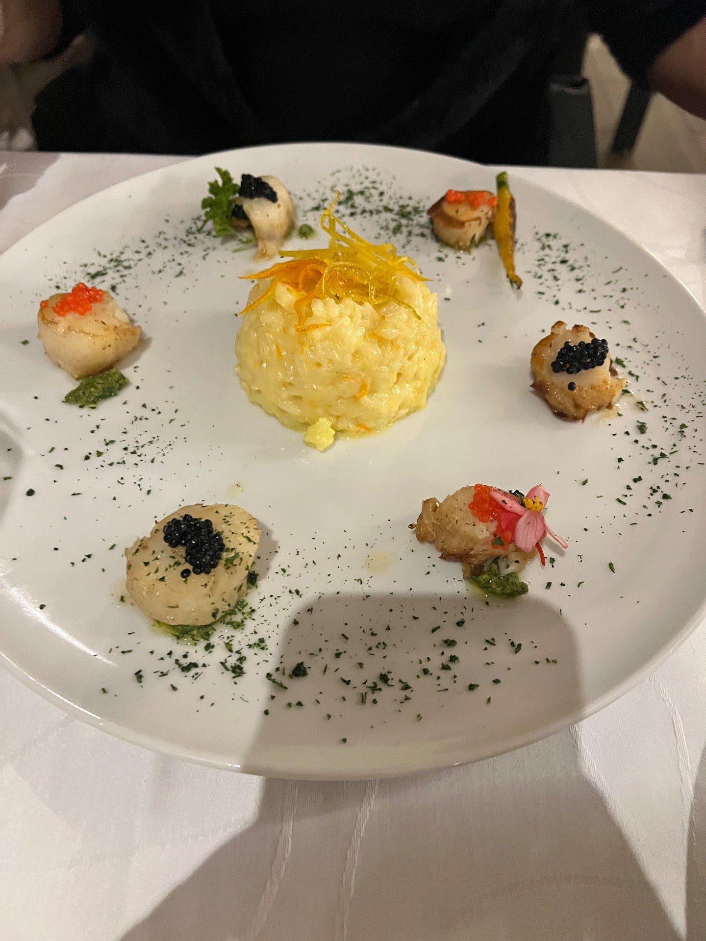 Seafood risotto with candied orange zest ringed by seared scallops with caviar and roe at Franco's Corner restaurant, Sao Martinho, Funchal, Madeira