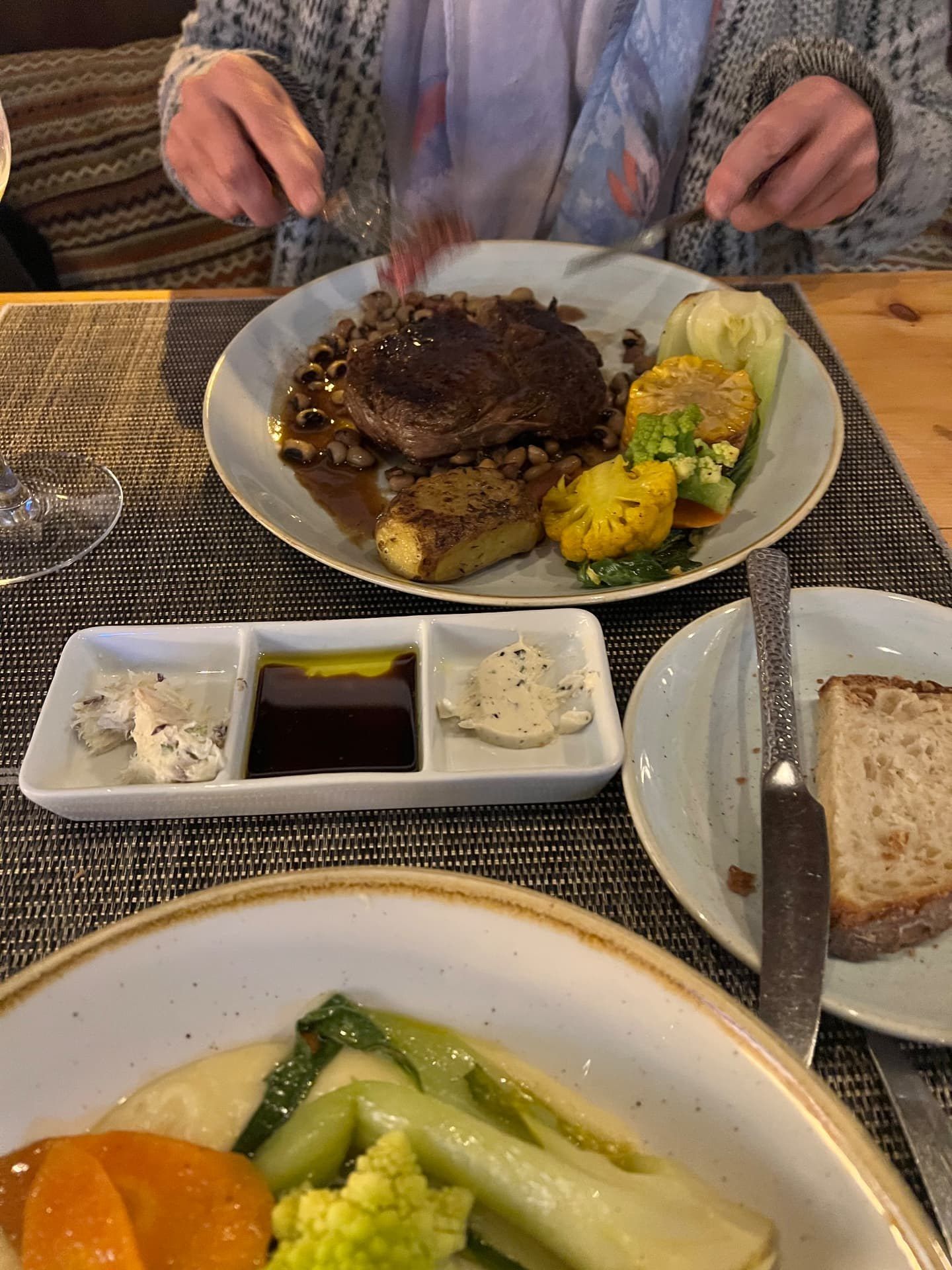 Grilled steak with black-eyed beans, fondant potato, corn, romanesco and pak choi at Laranjinha Bistro & Grill in Caniço, Madeira