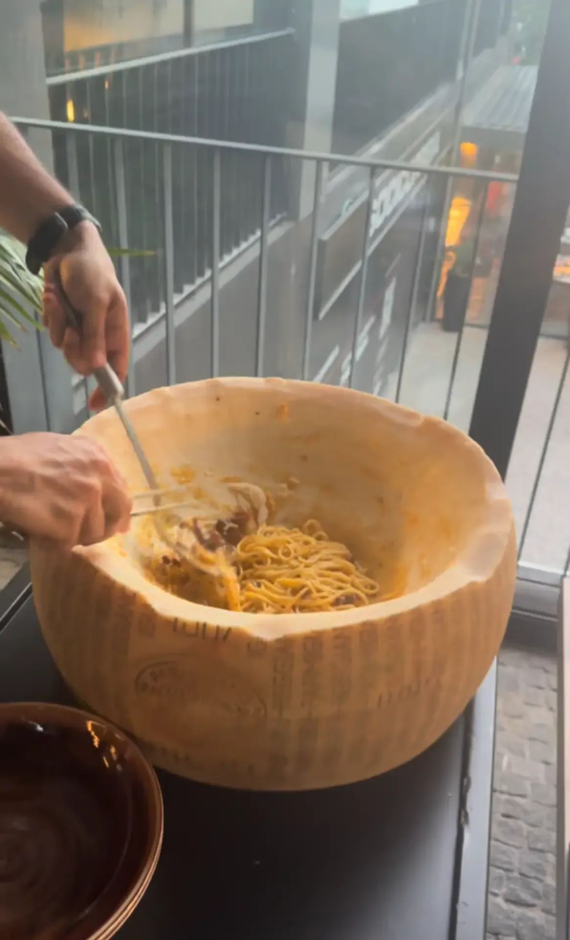 Fresh pasta tossed tableside in a giant cheese wheel at Lucca Italian Cuisine, Funchal