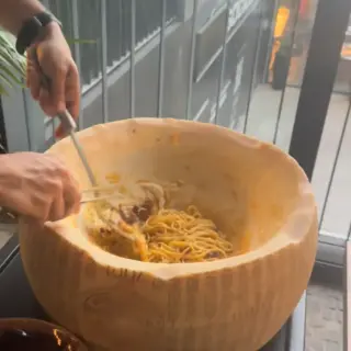 Fresh pasta tossed tableside in a giant cheese wheel at Lucca Italian Cuisine, Funchal