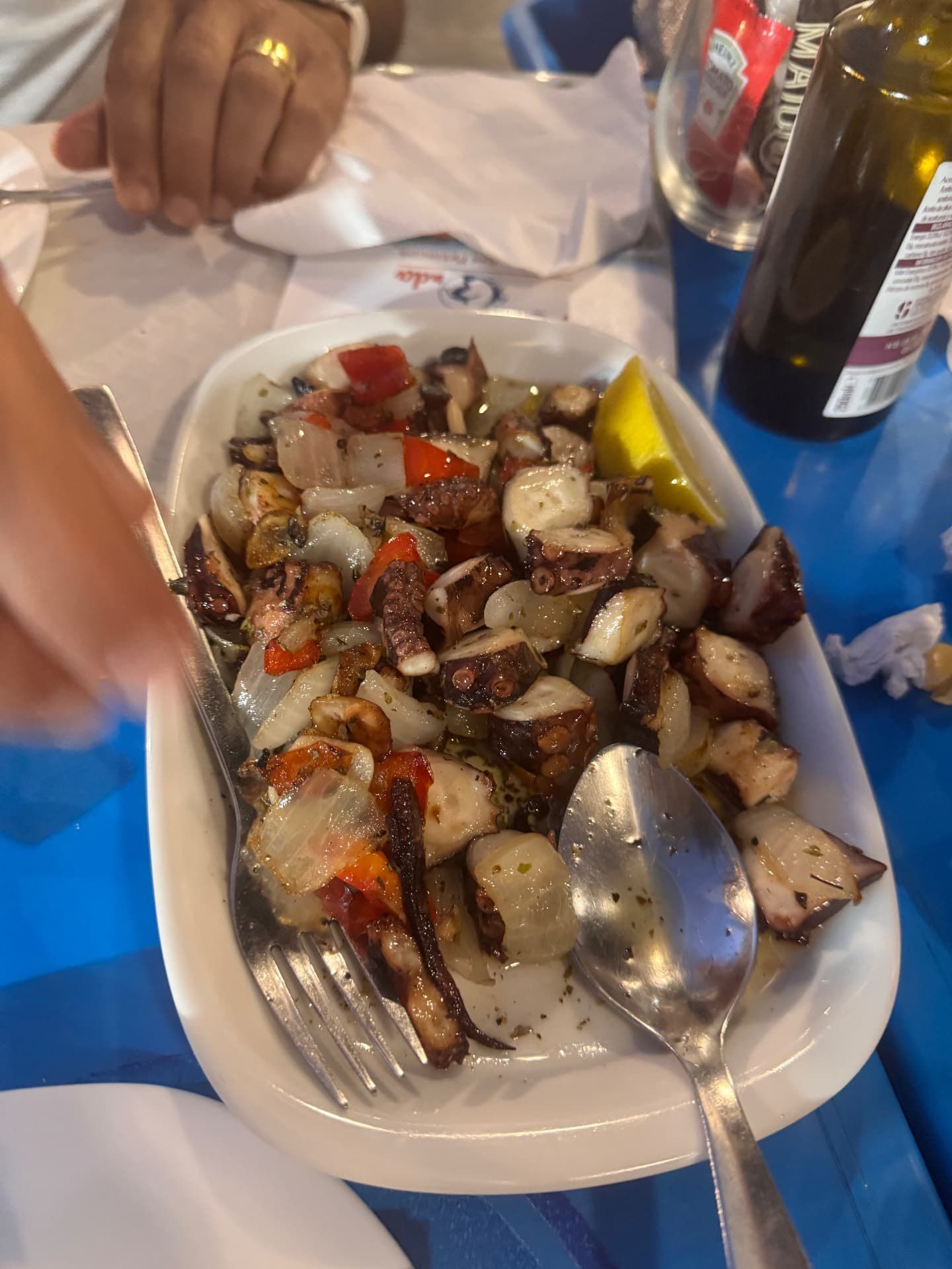 Octopus salad with onions, red peppers and a lemon wedge at Nova Onda Cantinho dos Petiscos in Caniço de Baixo, Madeira