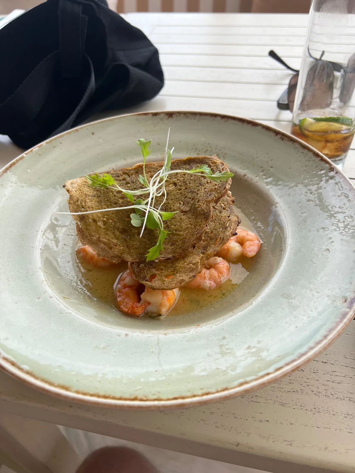 Prawn starter topped with toasted sourdough and micro herbs at Recharge Restaurant in Funchal