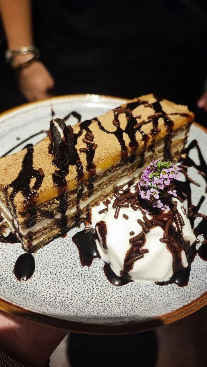Bolo de bolacha biscuit cake slice with chocolate sauce and ice cream dessert at Sabor a Fado restaurant, Funchal, Madeira