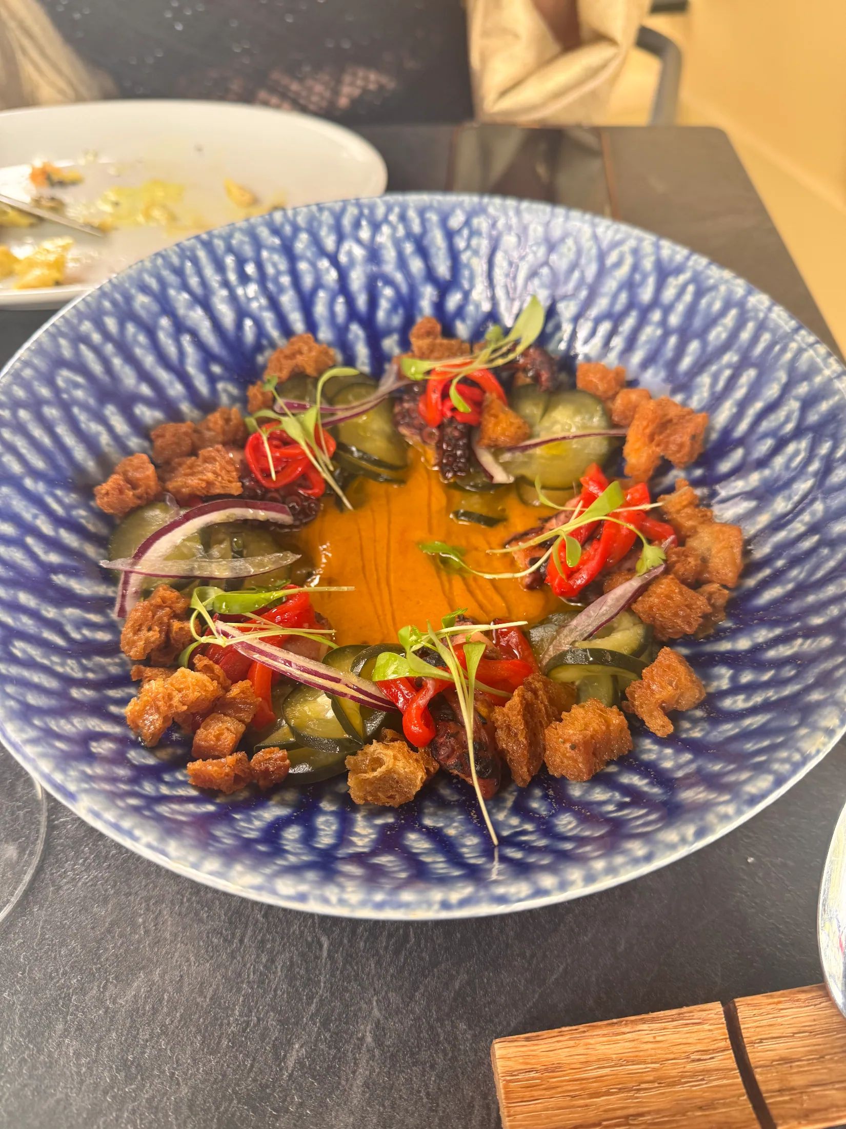Octopus with peppers and sauce
