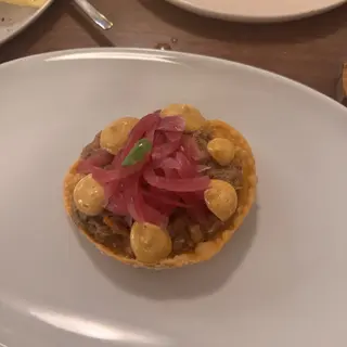 Shredded meat tartlet starter with pickled red onion and mustard cream at Theos restaurant, Funchal, Madeira