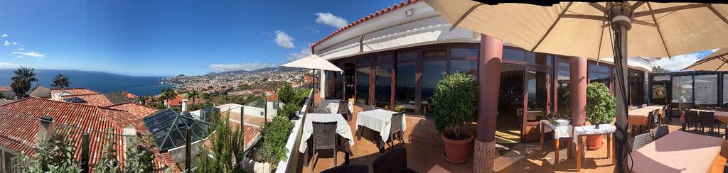 Panoramic terrace of O Zarco restaurant overlooking Funchal bay, Madeira