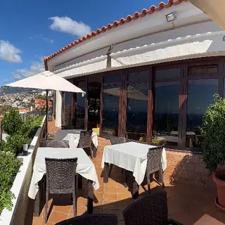 Panoramic terrace of O Zarco restaurant overlooking Funchal bay, Madeira