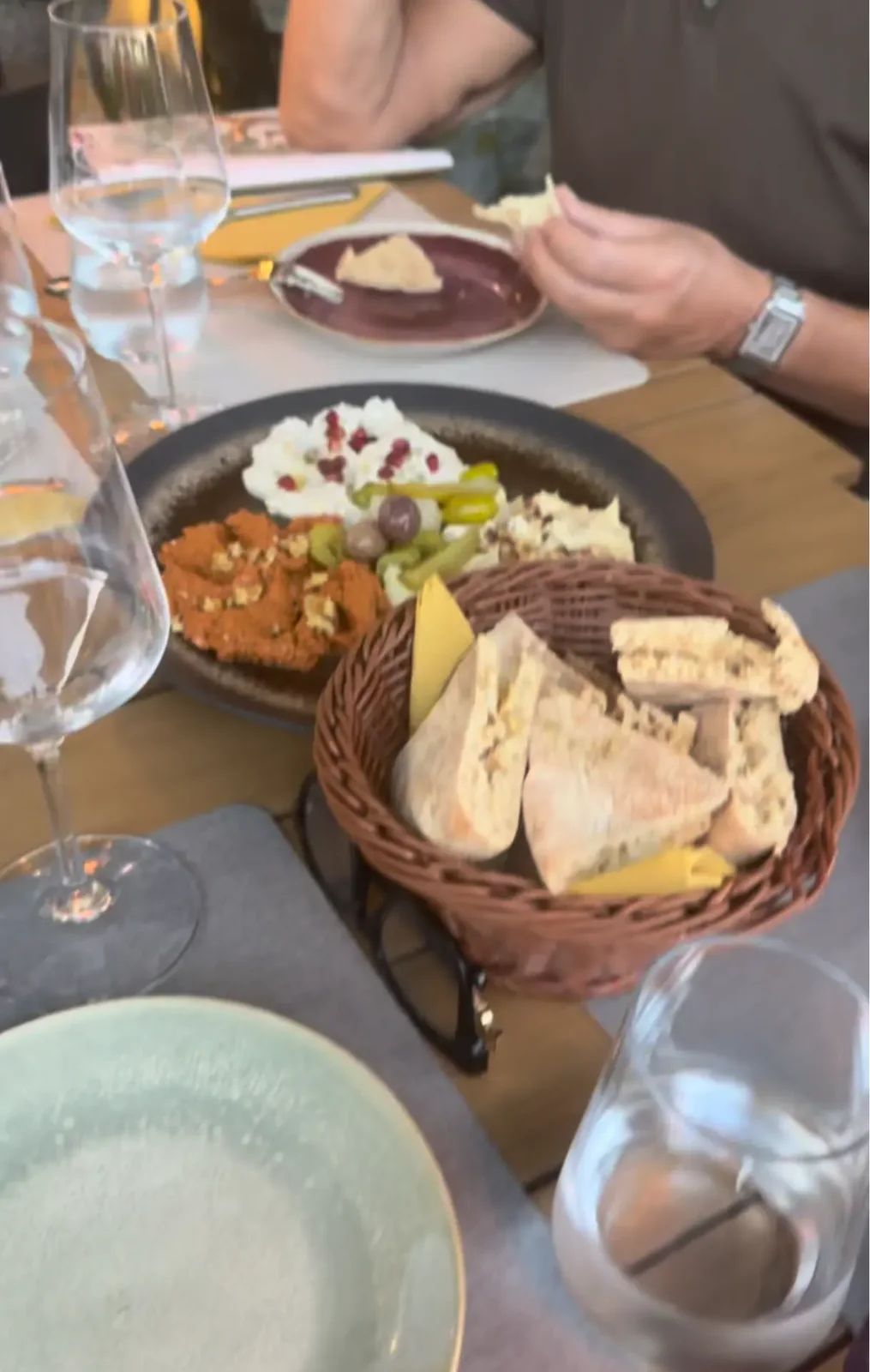 Meze and fresh pita bread on the table at Zaytun Levant restaurant, Funchal