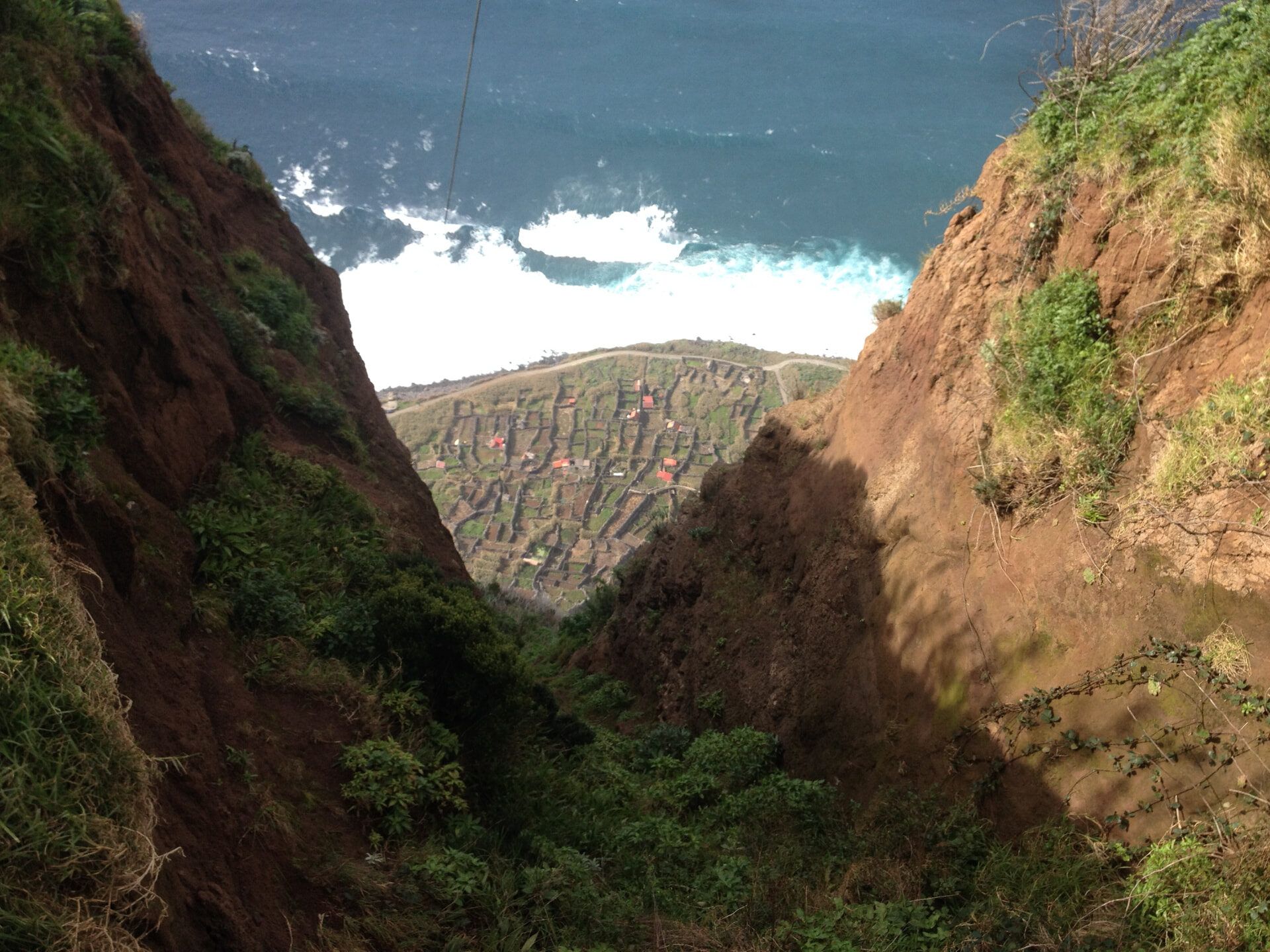 Looking down the Achadas da Cruz cable car ravine to the fajã below