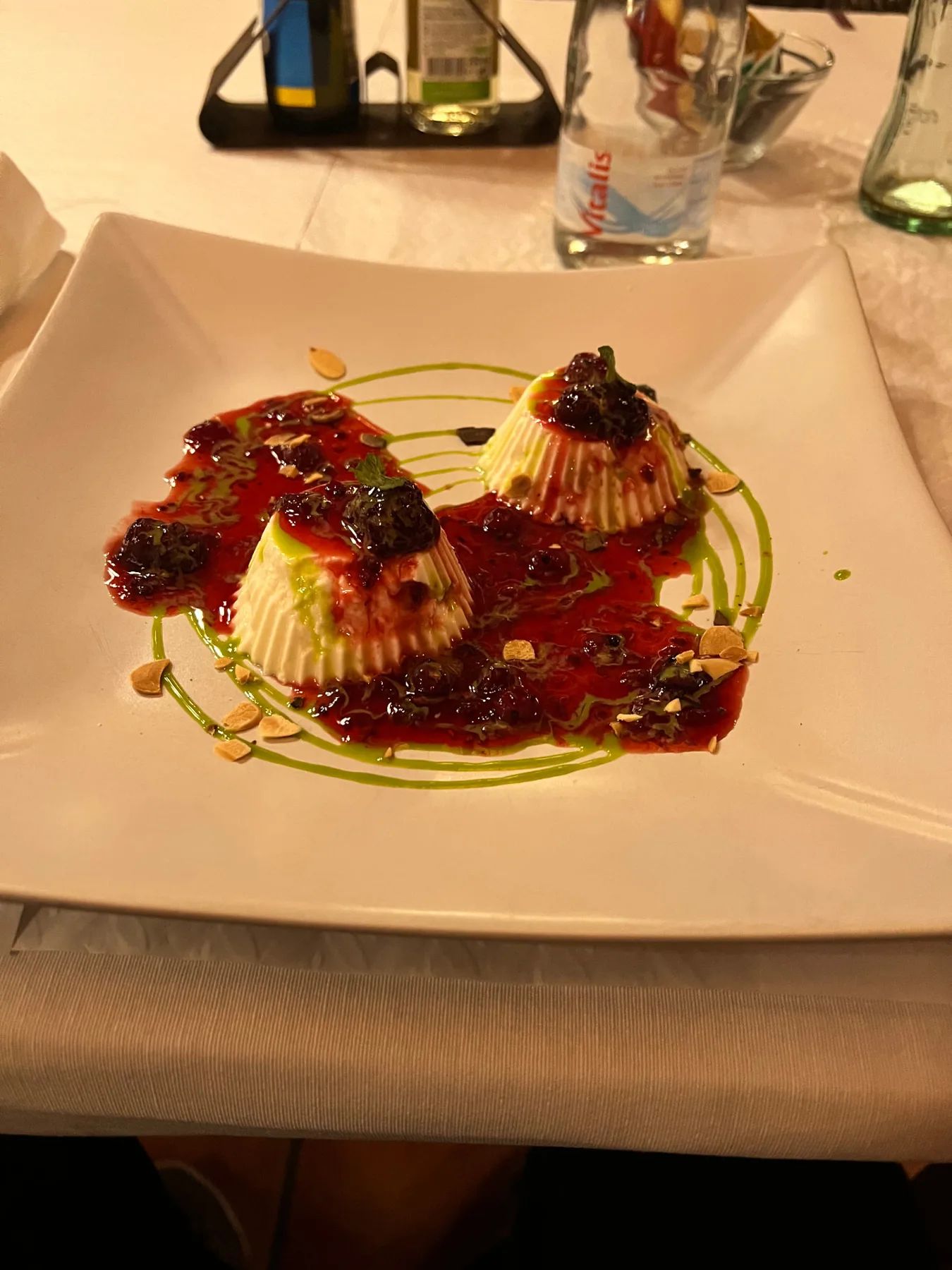 Panna cotta with red berry sauce and almonds at a Santana restaurant