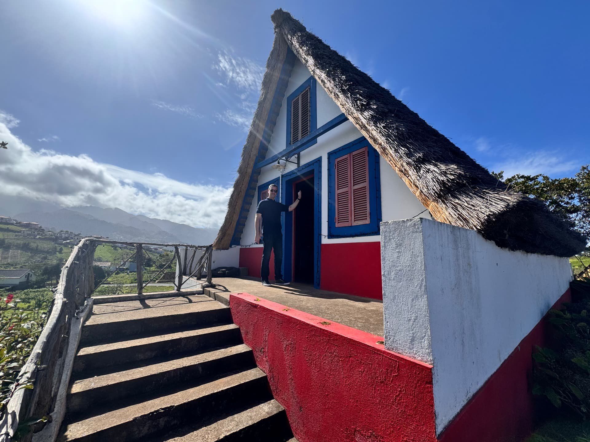 Inside a traditional Santana thatched house in Madeira, painted white, red and blue