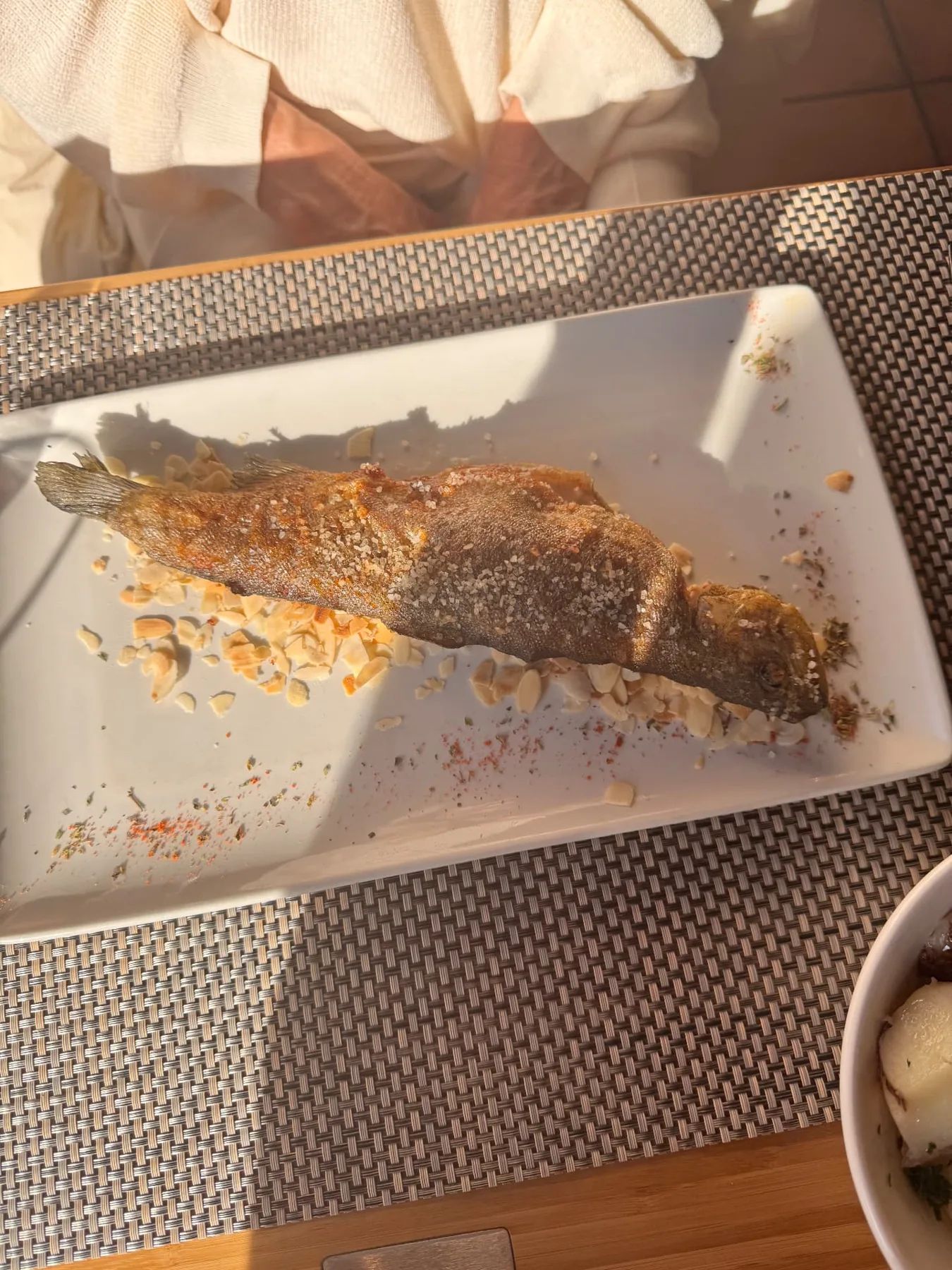 Whole fried trout on flaked almonds at a Santana restaurant