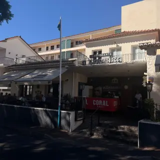 Restaurante A Lareira on Caniço town square, with diners on the shaded terrace