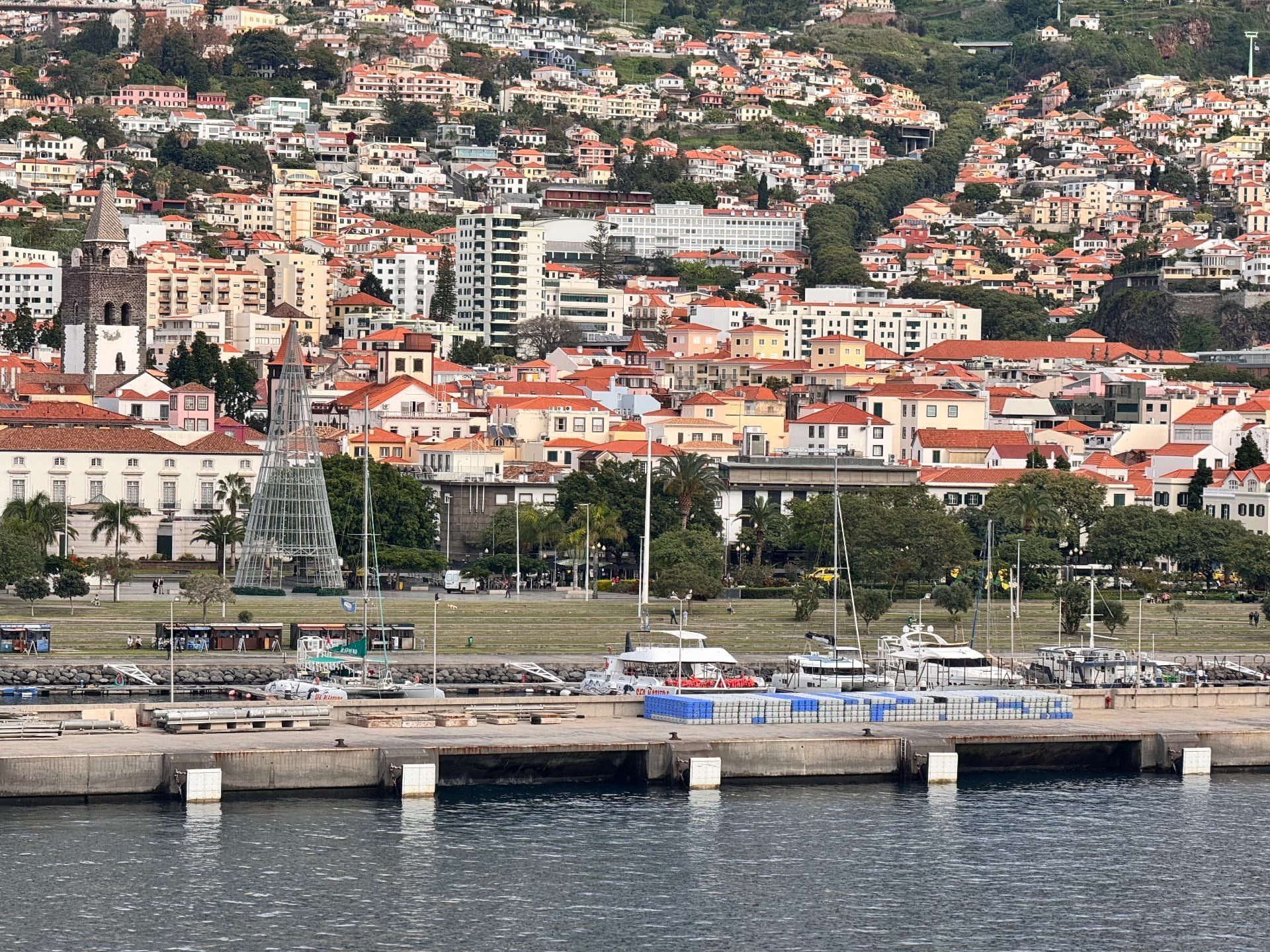 Funchal city centre and marina seen from the Atlantic, with the cathedral and mountains behind