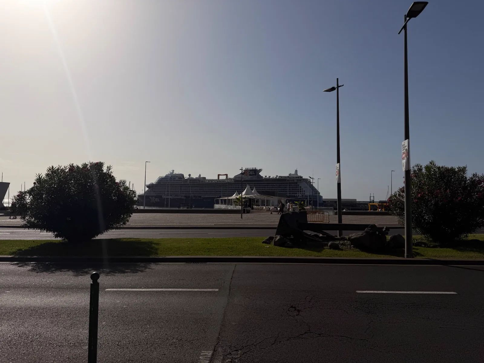 Celebrity Xcel cruise ship docked in Funchal harbour, seen across the seafront road