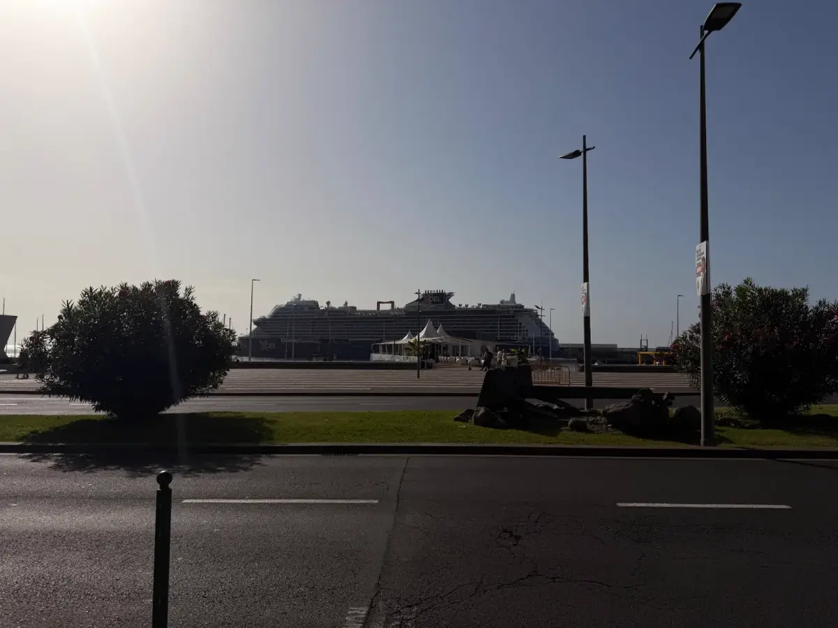 Celebrity Xcel cruise ship docked in Funchal harbour, seen across the seafront road