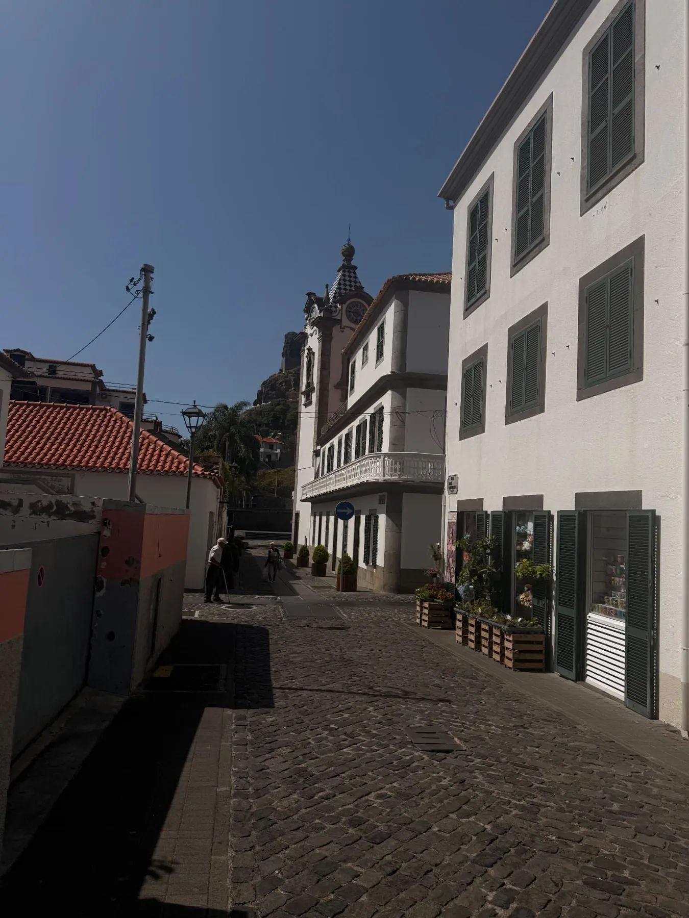 A cobbled lane in Ribeira Brava leading up to the São Bento church tower