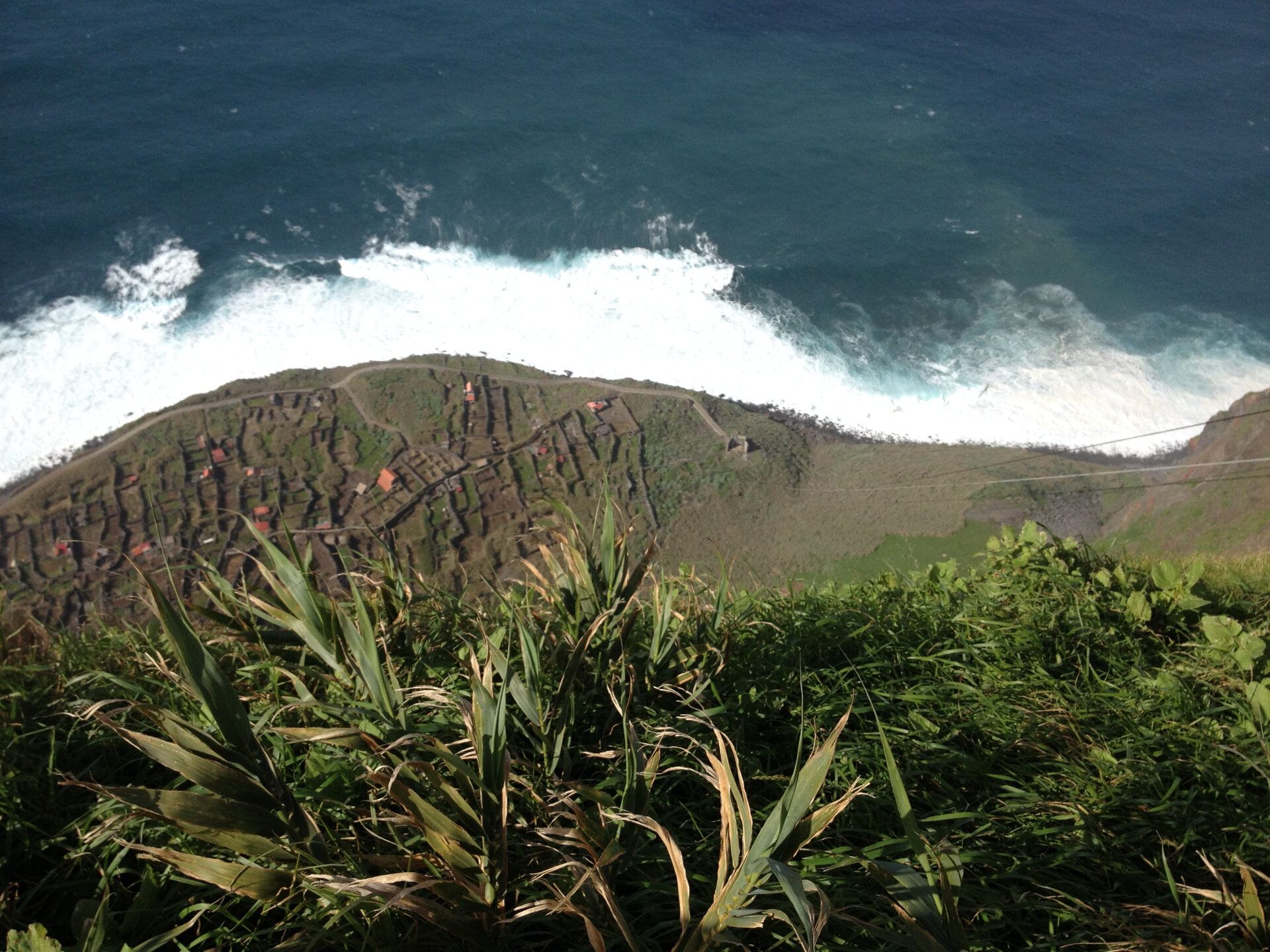 Vereda da Achadas da Cruz — terraced fajã fields beneath Atlantic surf