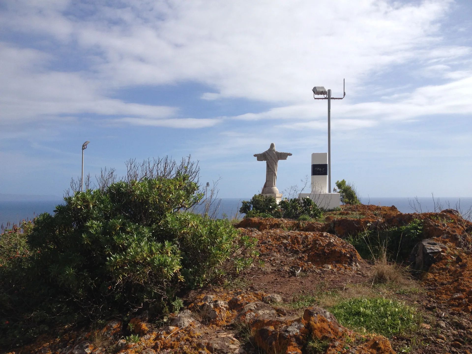 Cristo Rei statue standing on the Ponta do Garajau clifftop above the Atlantic, Madeira