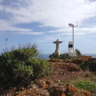 Cristo Rei statue standing on the Ponta do Garajau clifftop above the Atlantic, Madeira