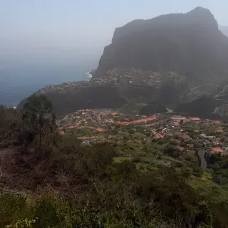 View from Miradouro do Curtado across Faial village to Penha de Águia and the Atlantic Ocean.